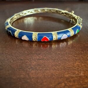 Girl’s Rhodium Hearts Bangle with Blue enamel. Super cute and great condition.